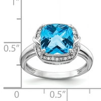 Prsten od srebra s dijamantom i plavim topazom. Težina karata je 0,1 karata. Težina dragulja - 3,76 karata